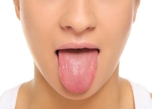 مزه خون زیر زبان به چه علت به وجود می آید؟